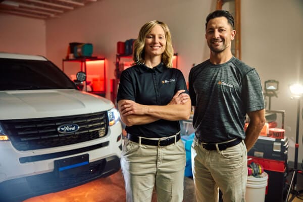 Bio-One Gaithersburg team in a garage with biohazard decontamination equipment, serving Gaithersburg, Maryland and surrounding areas.